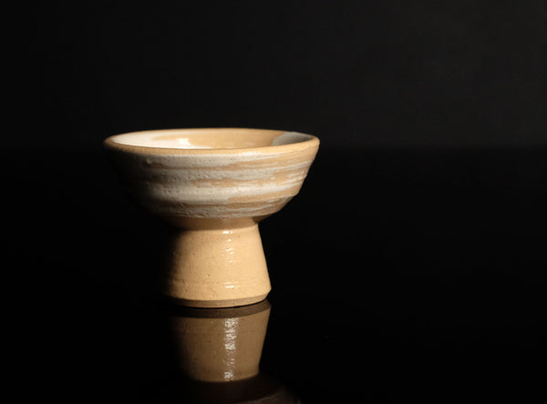 Ceramic Sake Cup on a black reflective surface