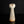 將圖片載入到圖庫檢視器中， A small sculptural ceramic vase with a tall, flared, tulip-like top and a narrow tapered body, shown on a glossy black surface against a black background.
