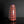 將圖片載入到圖庫檢視器中， A tall, narrow ceramic vase with a glossy red and blue floral pattern, standing on a reflective black surface against a dark gray background.
