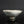 將圖片載入到圖庫檢視器中， A handmade ceramic bowl with a light gray and white glaze featuring a prominent crackle pattern, resting on a dark reflective surface against a dark gray background.
