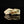 將圖片載入到圖庫檢視器中， A sculptural ceramic incense box (kōgō) by Ayukai Kōgetsu, modelled in a stylised Mount Fuji form. Its low, angular silhouette combines softly raised contours with flowing cream, olive-green and brown glazes.

The lid rises towards an irregular summit, with sloping sides suggesting the mountain’s distinctive outline. Uneven ridges and gently softened edges give the piece an organic character, interpreting the subject through expressive modelling rather than precise symmetry.
