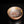 Load image into Gallery viewer, A ceramic bowl with a warm terracotta-colored exterior, decorated with three gold circular accents on the inside rim, and a white interior featuring a red hand-painted dragon motif.
