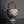 Load image into Gallery viewer, Vintage ceramic vase with a woven handle on a black background
