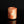 將圖片載入到圖庫檢視器中， A small cylindrical cup made of marbled orange, peach, and cream ceramic, standing on a reflective black surface against a black background.
