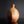 將圖片載入到圖庫檢視器中， A handmade ceramic bottle with a rounded body and a short, narrow neck, featuring a textured earthy glaze with a gradient from reddish-brown at the top to beige at the bottom, set against a dark gray background.
