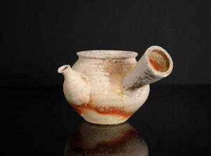 Ceramic a shigaraki guinomi  with a unique design on a black background