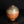 Load image into Gallery viewer, A round ceramic vase with a narrow neck, featuring a glossy glaze that transitions from beige at the top to a warm terracotta orange at the bottom, set against a dark reflective background.
