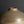 Load image into Gallery viewer, Close-up of a ceramic vase with a rounded, bulbous body and a narrow, slightly flared neck, featuring a speckled earthy brown and beige glaze against a dark gray background.
