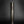 將圖片載入到圖庫檢視器中， A dark metallic cylindrical flower vase standing upright on a reflective black surface against a dark gray gradient background.
