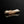 Load image into Gallery viewer, A Set of Five Bizen Chopstick Rests with a metallic sheen on a black reflective surface
