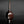 將圖片載入到圖庫檢視器中， A glossy dark reddish-brown ceramic vase with a narrow neck and bulbous body, standing on a reflective black surface against a dark gray background.
