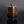 Load image into Gallery viewer, A Shudo Bronze Vase with layered design on a dark background

