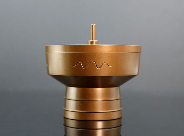 A Brass Incense Burner "Tsuchinoto-Mi"  on a black background