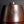 將圖片載入到圖庫檢視器中， A metallic reddish-brown urn-shaped vase, photographed against a dark gray to black gradient studio background.
