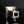 Load image into Gallery viewer, A rectangular metallic box with a textured, brushed silver finish and a small rectangular window on top, set against a dark gray gradient background.
