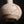 Load image into Gallery viewer, Close-up of a textured ceramic object with brown speckles on a black background
