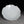 將圖片載入到圖庫檢視器中， White ceramic plate with floral design on a dark background
