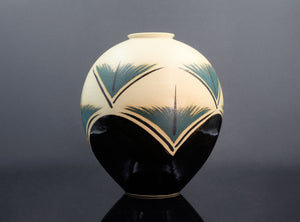Decorative vase with geometric design on a dark background