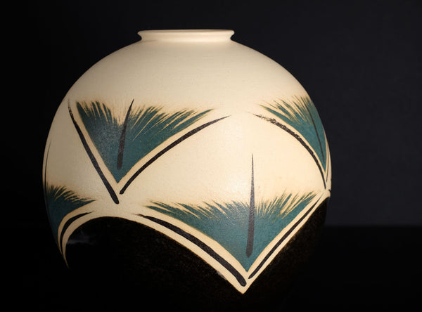 Decorative vase with geometric design on a black background
