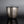 Load image into Gallery viewer, A textured silver metal container with a matching lid and a small top loop handle, photographed on a dark reflective surface against a gray gradient background.
