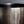 Load image into Gallery viewer, Close-up of a dark metallic bowl with horizontal grooved texture and three vertical oval cutouts on the front, shown against a dark gray background.
