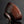 將圖片載入到圖庫檢視器中， A dark brown textured ceramic tea bowl with a glossy glaze, shown on a reflective black surface against a dark gray background.
