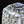將圖片載入到圖庫檢視器中， Close-up of a ceramic vase with textured surface and decorative patterns on a black background
