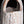 將圖片載入到圖庫檢視器中， Close-up of a textured ceramic vase with a dark background
