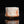 Load image into Gallery viewer, Coral-like object with red and white patterns on a black background
