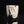 Load image into Gallery viewer, Ceramic cup with brown and white glaze on a black background
