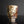 將圖片載入到圖庫檢視器中， A handmade ceramic cup with a textured, mottled glaze in earthy tones of brown, beige, and white, standing on a reflective black surface against a dark gray background.
