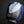 Load image into Gallery viewer, A handmade ceramic cup with a textured, faceted design, featuring a glossy blue and matte black glaze with a light blue and white cracked tile motif on the front, set against a dark background.
