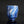 Load image into Gallery viewer, A small ceramic cup with a blue and white marbled, tree-like glaze pattern, shown on a dark reflective surface against a black background.
