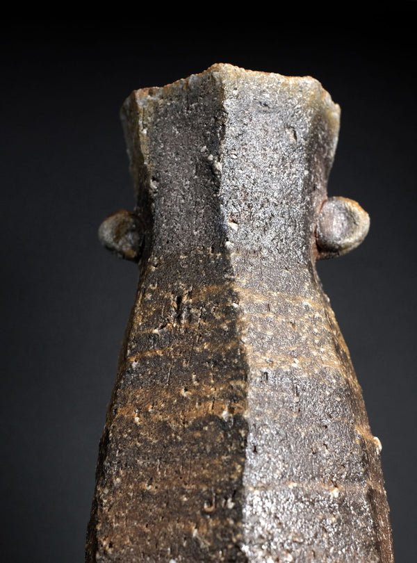 Close-up of a vase with a dark background