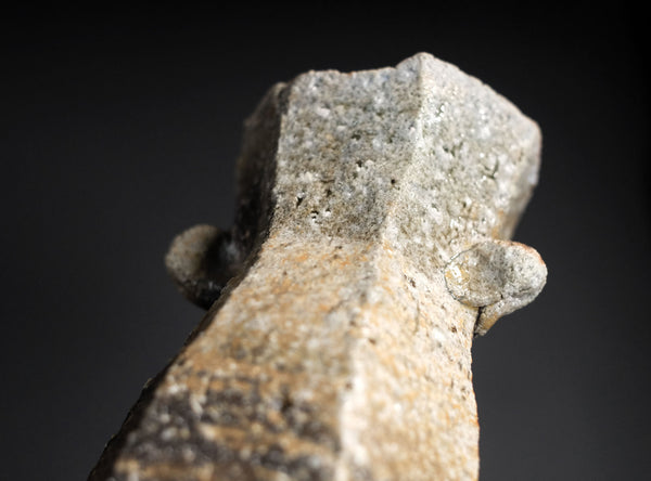 Close-up of a vase object with a dark background