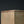 Load image into Gallery viewer, Close-up of a square metal block corner showing a textured, hammered metallic surface in a warm bronze or copper tone against a dark background.
