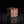Load image into Gallery viewer, A small square decorative box with a lid, featuring a textured metallic surface in coppery red and green patina tones, set against a solid black background with a soft reflection below.
