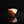 將圖片載入到圖庫檢視器中， A handmade ceramic cup with a diagonal split design, featuring a reddish-brown textured clay exterior and a smooth off-white glazed interior, set against a solid black background with a clear reflection below.
