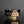 將圖片載入到圖庫檢視器中， Ceramic cup with black and beige geometric pattern on a reflective surface with dark background
