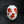 Load image into Gallery viewer, A white ceramic vase decorated with red painted leaves and berries, set against a dark black background.
