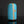 Load image into Gallery viewer, Blue cylindrical ceramic vase with gold accents on a dark background
