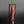 Load image into Gallery viewer, Cylindrical vase with red and black abstract design on a gray background

