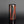 Load image into Gallery viewer, Cylindrical vase with black and red design on a gray background

