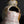 Load image into Gallery viewer, Close-up of a small handmade ceramic vase with a unique organic shape, featuring a pink and white glaze with brown and gold accents, set against a dark gray background with a reflective black surface.
