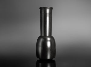 A Bronze Kinuta Flower Vase with a flared cylindrical neck and a rounded base, standing on a reflective black surface against a gray gradient background.