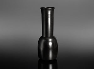 A Bronze Kinuta Flower Vase with a flared cylindrical neck and a rounded base, standing on a reflective black surface against a gray gradient background.