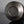 將圖片載入到圖庫檢視器中， A close-up of a Bronze Kinuta Flower Vase, photographed on a reflective dark surface against a gray studio background.
