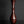 Load image into Gallery viewer, A tall, slender ceramic vase with a flared rim and bulbous base, finished in glossy dark reddish-brown glaze, set against a dark gray background on a reflective black surface.
