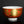 Load image into Gallery viewer, Decorative cup with red and gold design on a black background
