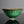 將圖片載入到圖庫檢視器中， A green glazed ceramic bowl with dark brown dripping glaze details and a white band near the base, set against a dark gray background.
